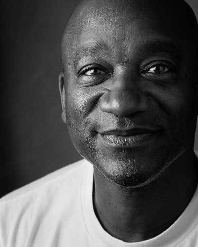 Man smiling in black and white