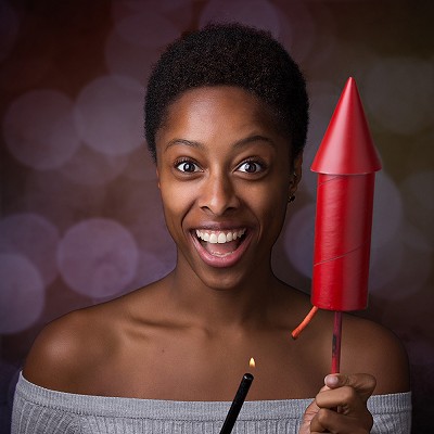 Woman lighting a huge firecracker